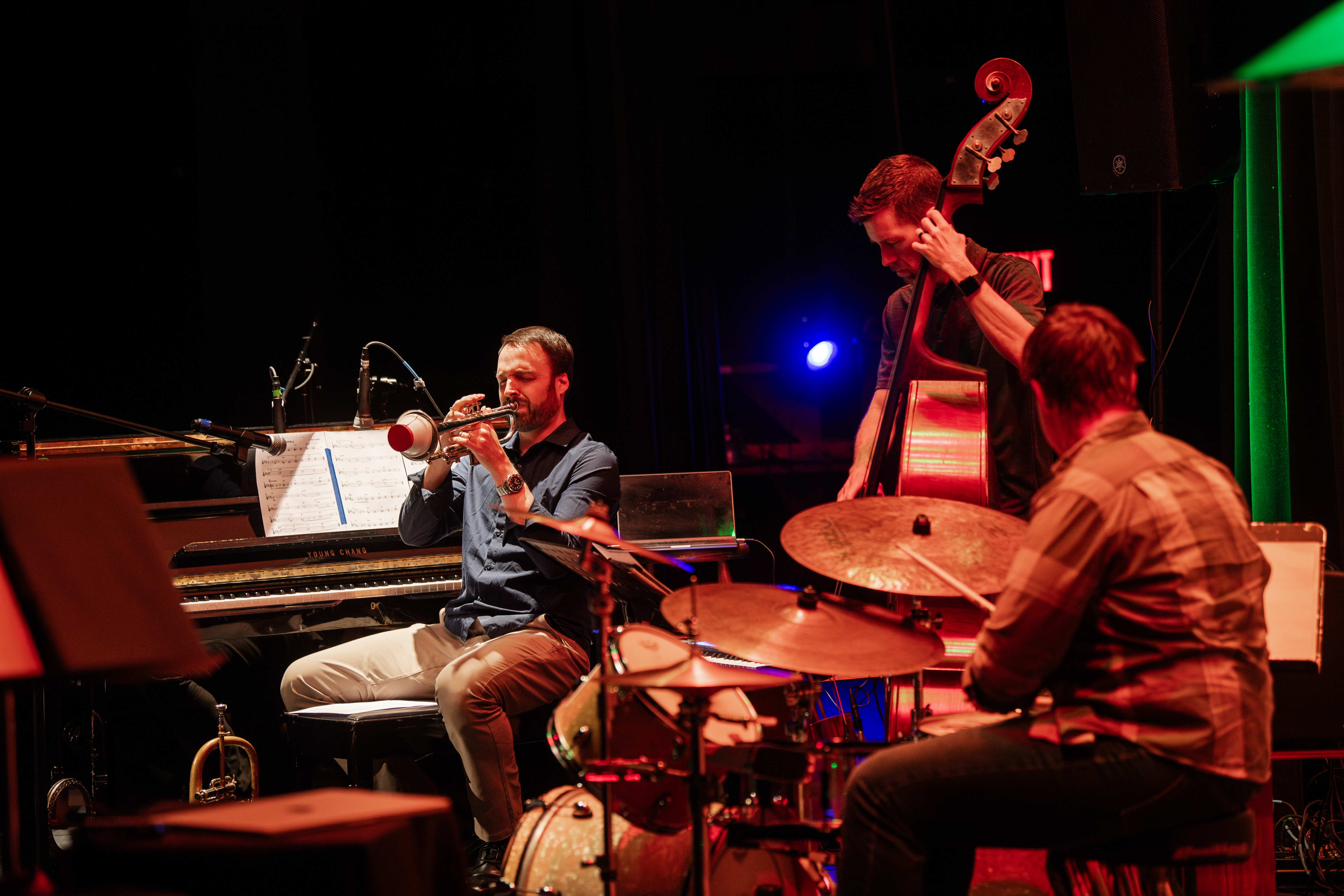 TechTet trio in performance — Cameron Summers on trumpet with bass and drums